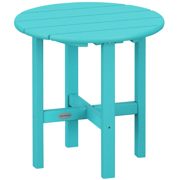 A blue POLYWOOD round side table with a wooden top on a outdoor patio.