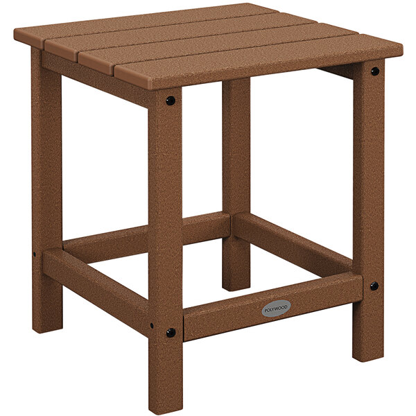 A brown POLYWOOD side table with a wooden top on an outdoor patio.
