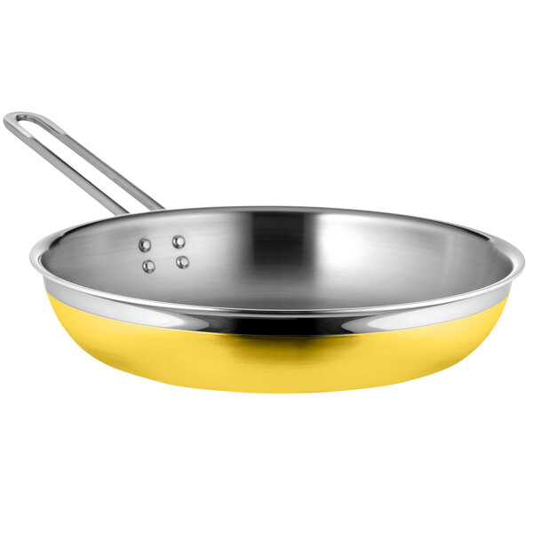 A Bon Chef yellow stainless steel saute pan with long handle.