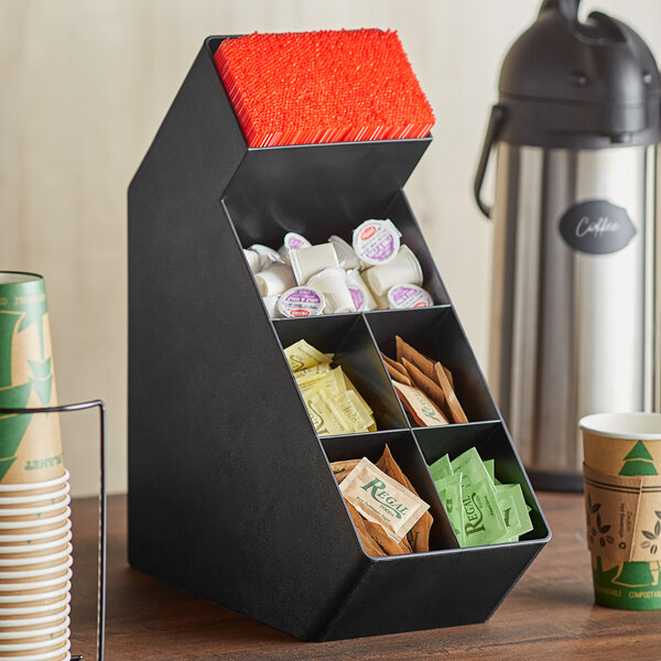 A black Choice countertop condiment organizer filled with a variety of condiments.