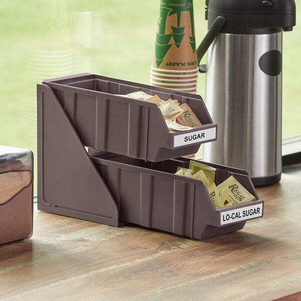 A brown 2-tier self-serve organizer set with plastic bins on top.