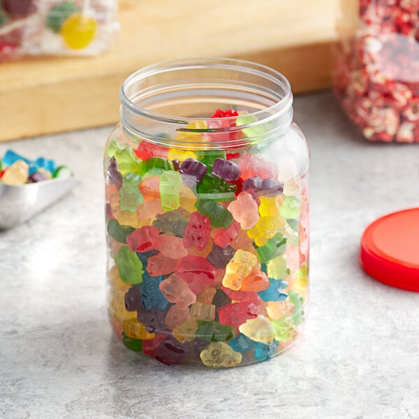 A 64 oz. round PET plastic jar filled with colorful gummy bears.