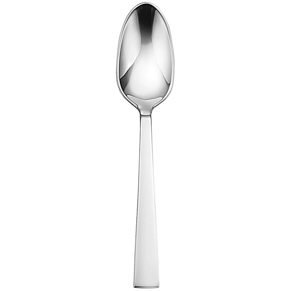 A close-up of a Sant'Andrea Fulcrum stainless steel European teaspoon with a white handle.