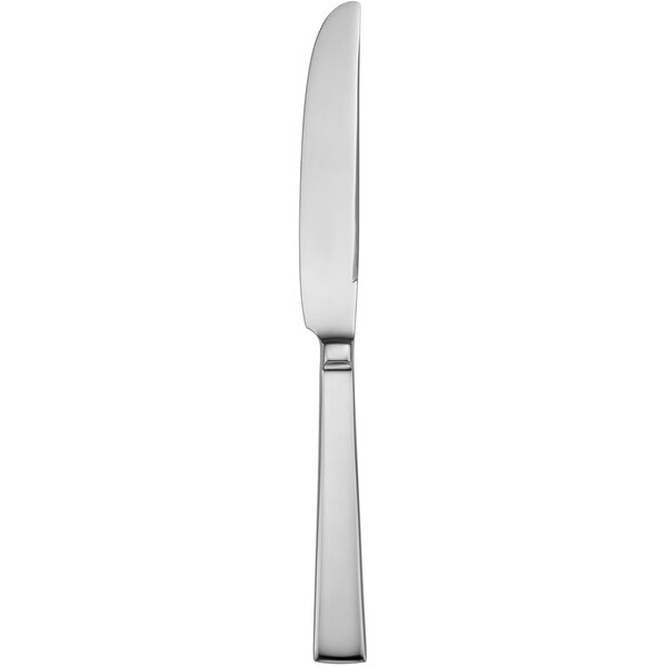 A silver dessert knife with black lines on the handle.