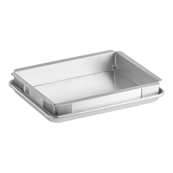 A metal quarter size extender and bun pan sheet cake pan set.