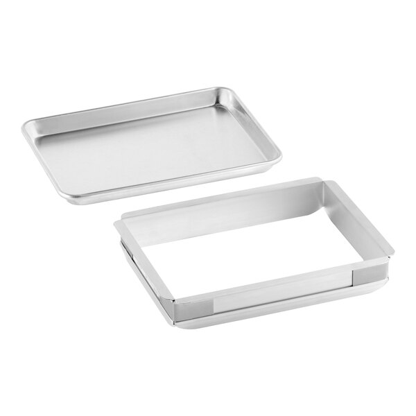 A rectangular metal sheet cake pan set with a matching quarter size extender.