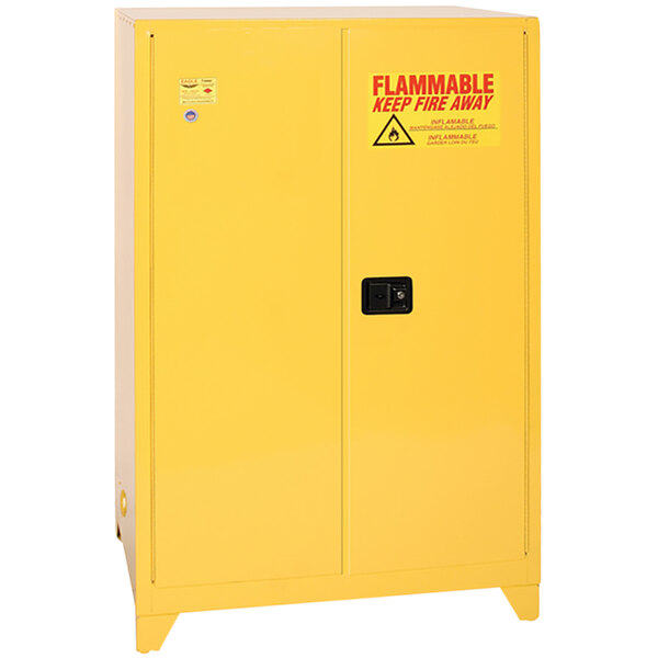 A yellow metal safety cabinet with a warning sign.