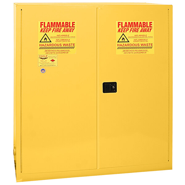 A yellow Eagle Manufacturing safety cabinet with two doors.