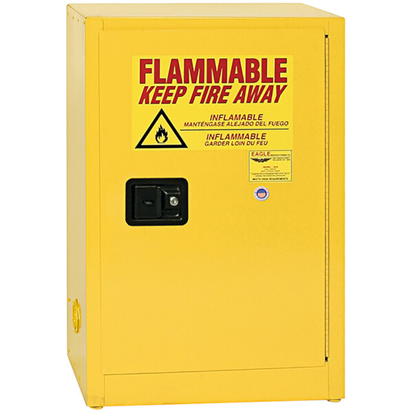 A yellow Eagle Manufacturing flammable safety cabinet with a black handle and red sign.