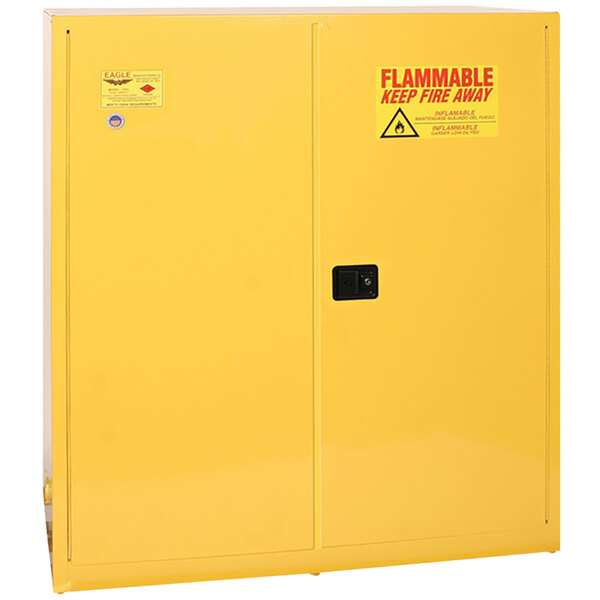 A yellow Eagle Manufacturing safety cabinet with two self-closing doors.