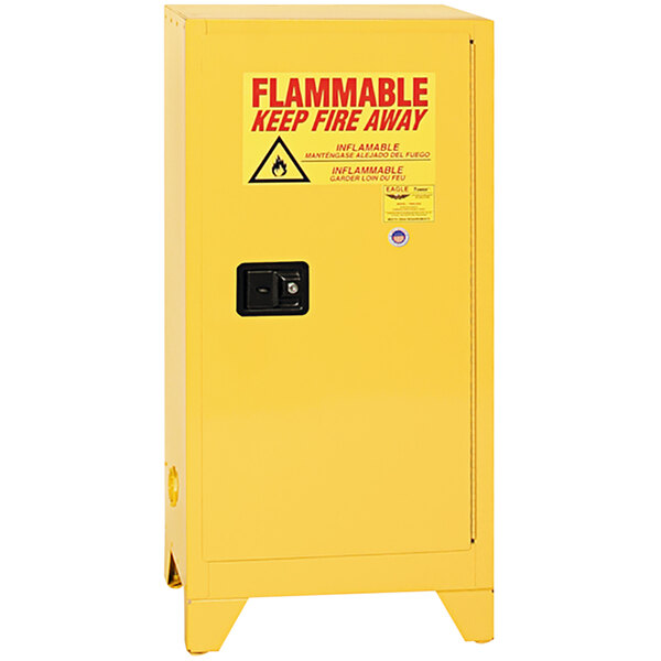 A yellow Eagle Manufacturing safety cabinet with a red "flammable" warning sign.