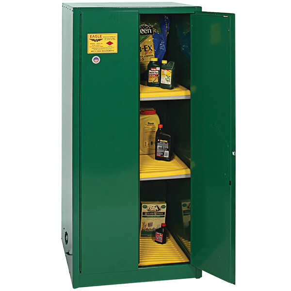 A green Eagle Manufacturing pesticide safety cabinet with shelves and doors.