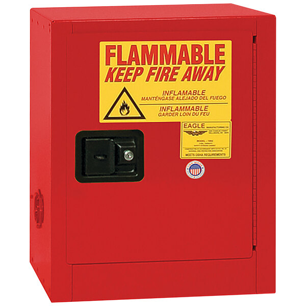 A red Eagle Manufacturing safety cabinet with a yellow sign that says "Flammable" and a self-closing door.