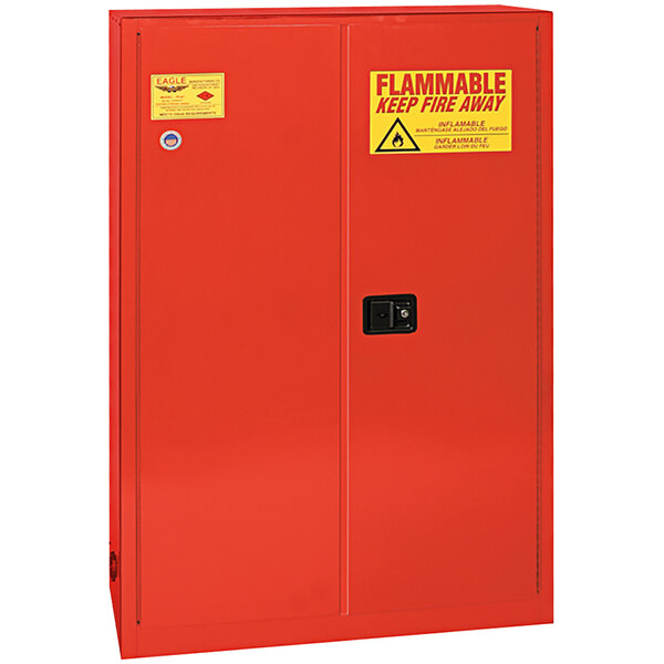 An Eagle red metal safety cabinet with yellow warning signs.