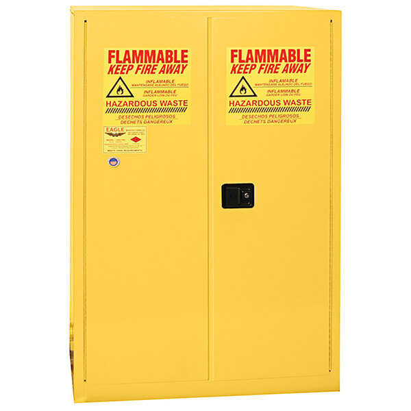 A yellow Eagle Manufacturing HazMat safety cabinet with 2 self-closing doors and a shelf.