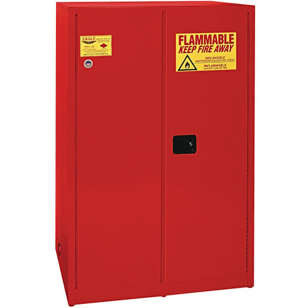 A red metal Eagle safety cabinet with yellow and red warning labels.