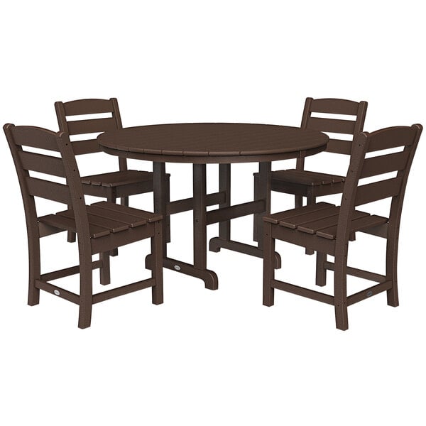 A POLYWOOD round dining table in mahogany with four chairs on an outdoor patio.