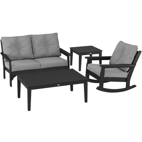 A black and grey POLYWOOD patio set with chairs and a table.