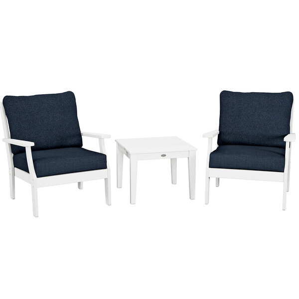 A white POLYWOOD table with white legs and two blue and white chairs.