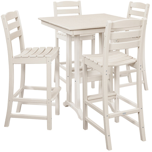A white POLYWOOD bar table and four chairs on a white surface.