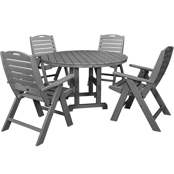 A POLYWOOD slate grey outdoor dining set with a table and four folding chairs.