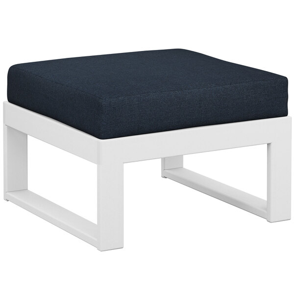 A white POLYWOOD ottoman with a blue cushion on a white surface.