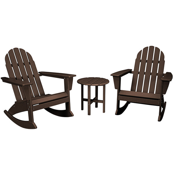 A round wooden table with a brown POLYWOOD Vineyard 3-piece Adirondack set on an outdoor patio.