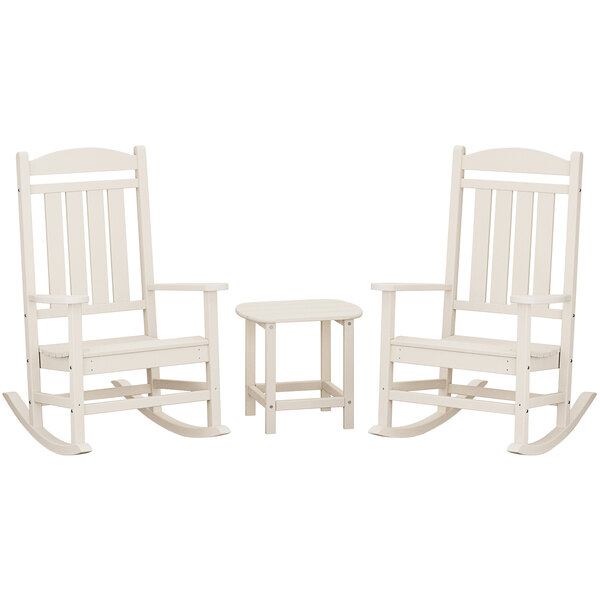 A group of white POLYWOOD rocking chairs with a white table with a square top.