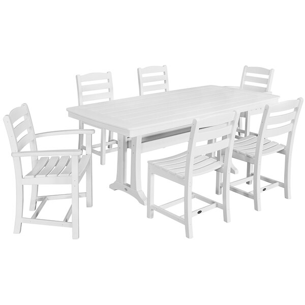 A white POLYWOOD table with six white chairs.