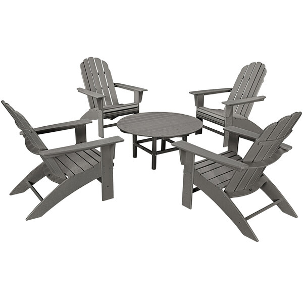 A POLYWOOD slate grey table and chairs set on an outdoor patio.