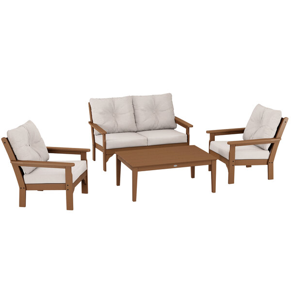 A POLYWOOD deep seating patio set with 2 chairs, a couch, and a wood table.