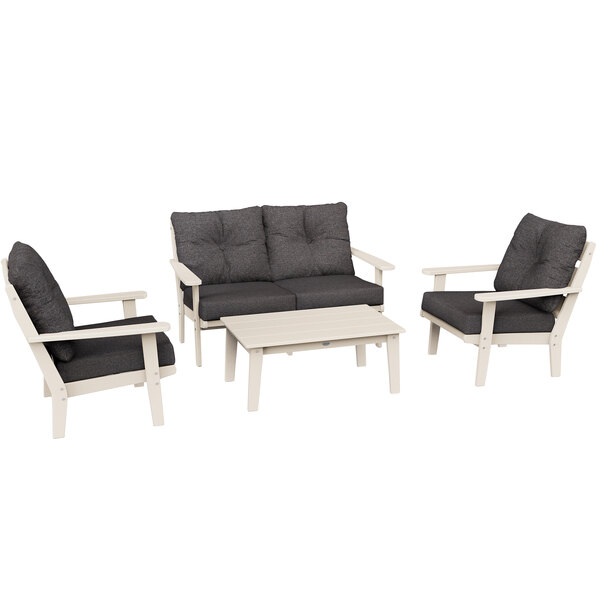 A POLYWOOD deep seating set with white cushions and a black table.