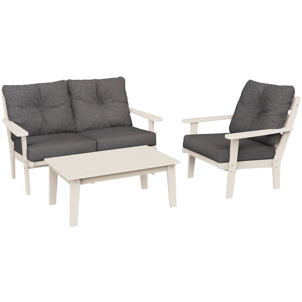 A grey POLYWOOD deep seating patio set with a white table.