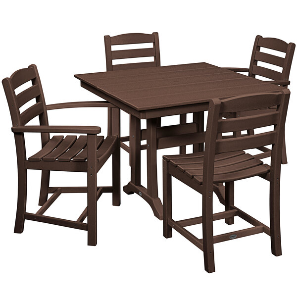 A POLYWOOD mahogany trestle table and chairs on an outdoor patio.