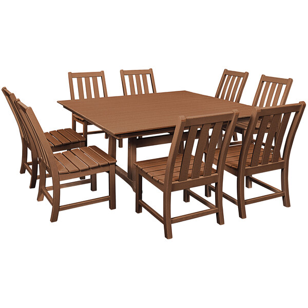 A POLYWOOD teak dining table and chairs on an outdoor patio.