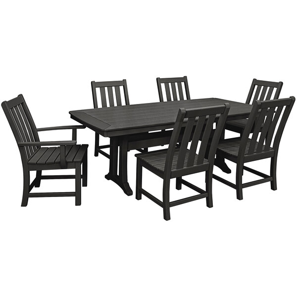 A black POLYWOOD dining table with a chair next to it.