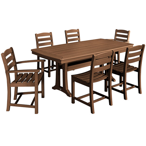 A POLYWOOD teak dining table with six chairs on an outdoor patio.