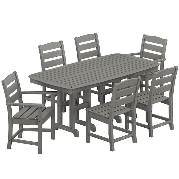 A POLYWOOD outdoor dining set with six gray chairs and a table on an outdoor patio.