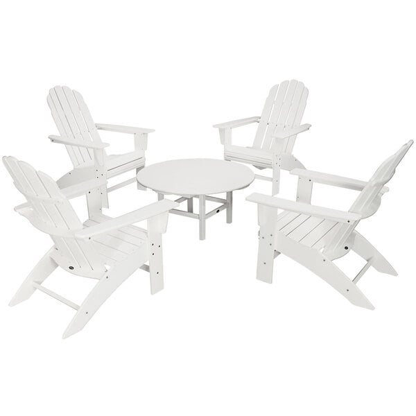 A white table with four white POLYWOOD Curveback Adirondack chairs.