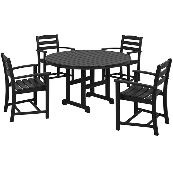 A POLYWOOD black outdoor dining set with four chairs around a table.