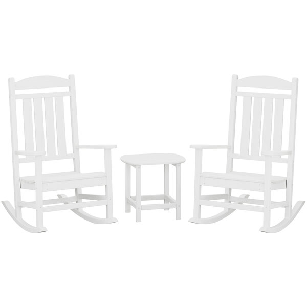 A white POLYWOOD Presidential rocking chair with a small white table.