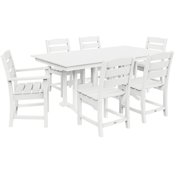 A white POLYWOOD table with a white background and six white chairs.