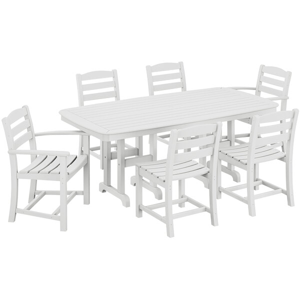 A white POLYWOOD dining table with six white chairs.