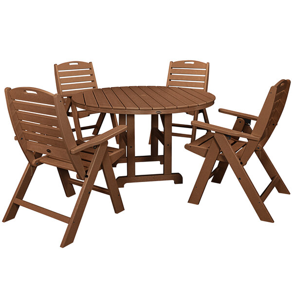 A POLYWOOD teak table with four folding chairs.
