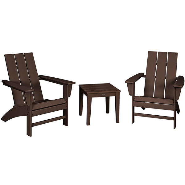 A group of brown POLYWOOD Adirondack chairs and a table on an outdoor patio.