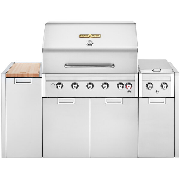 A stainless steel Crown Verity natural gas island cart grill with a white cover.