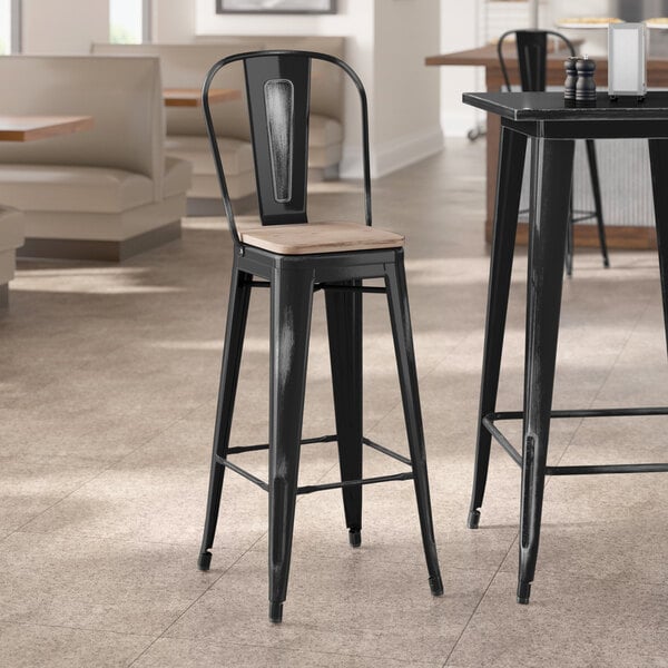 Lancaster Table & Seating Alloy Series Distressed Black Indoor Cafe Barstool with Gray Wood Seat