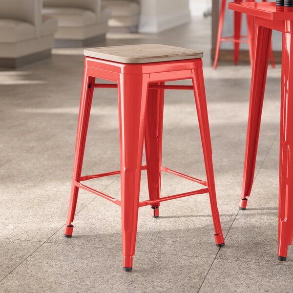 Lancaster Table & Seating Alloy Series Ruby Red Indoor Backless Counter Height Stool with Gray Wood Seat