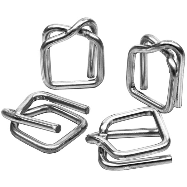 A counter with several square metal wire buckles.