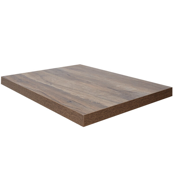 A BFM Seating knotty pine rectangular table top with a dark brown finish.